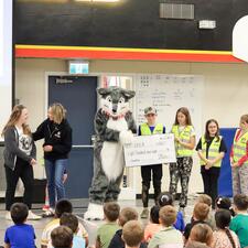 Large donation cheq presented to SPCA representative by joe and kindness club